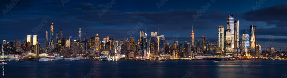 New York City (Manhattan) panoramic view at dusk from the Hudson River. The view includes the skyscrapers of Midtown West (Hudson Yards redevelopment project). NYC, NY, USA