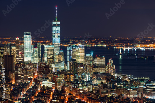 Aerial night view of the Financial District of New York City. View of World Trade Center skyscrapers and New York Harbor. Lower Manhattan, NY, USA
