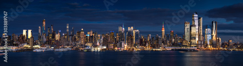 New York City  Manhattan  panoramic view at dusk from the Hudson River. The view includes the skyscrapers of Midtown West  Hudson Yards redevelopment project . NYC  NY  USA