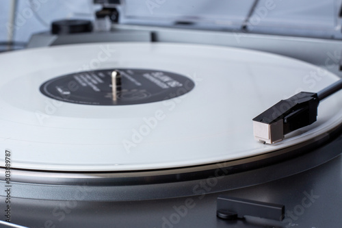 Turntable with white vinyl record. Hi-fi music lover concept