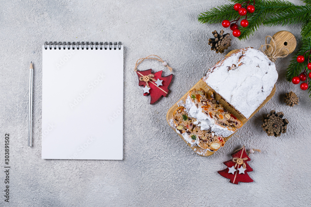 Fotografie Christmas stollen on light concrete background