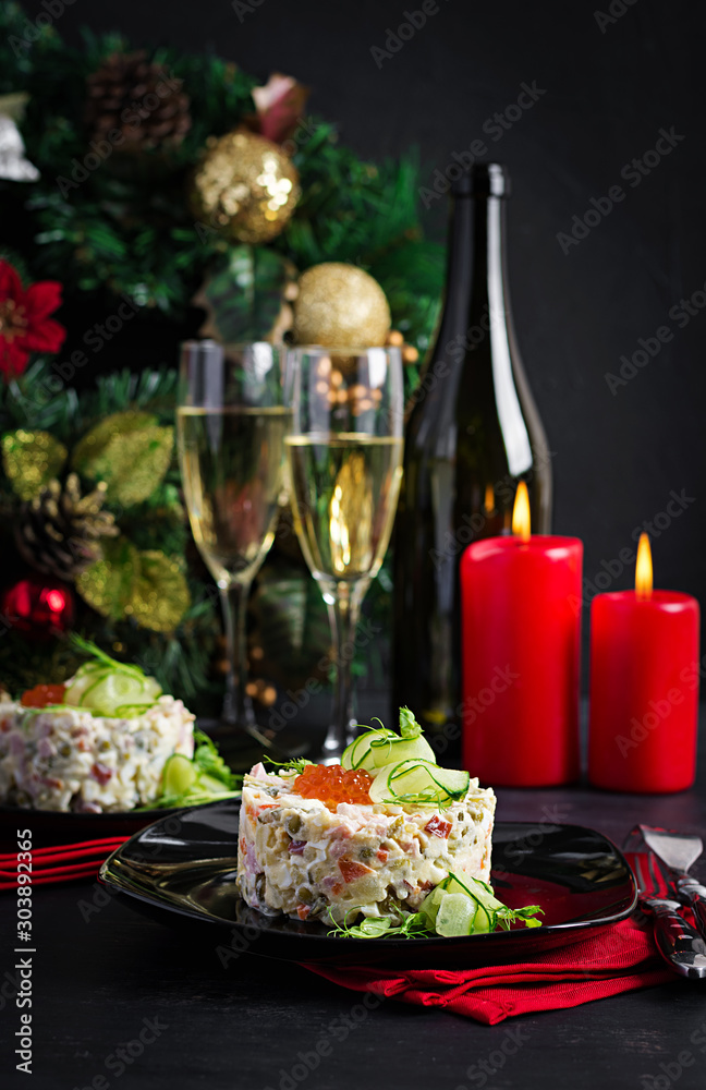 Christmas table setting. Traditional Russian salad 