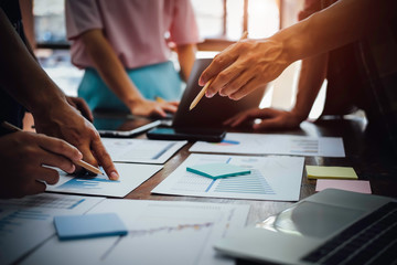 Asian business adviser meeting to analyze and discuss the situation on the financial report in the meeting room.Investment Consultant,Financial Consultant,Financial advisor and accounting concept