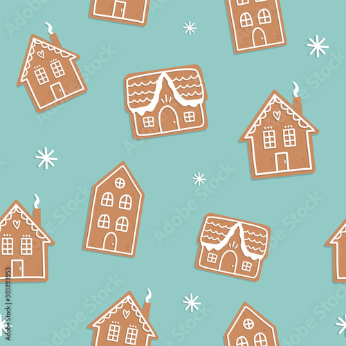 Gingerbread houses vector seamless pattern on blue background