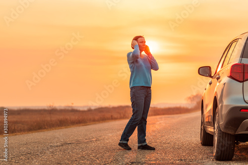 Tableau sur toile Woman calling for assistance and help on the road
