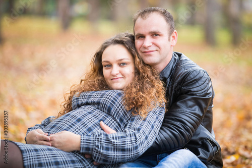 Happy pregnant couple  in autumn background © 2207918