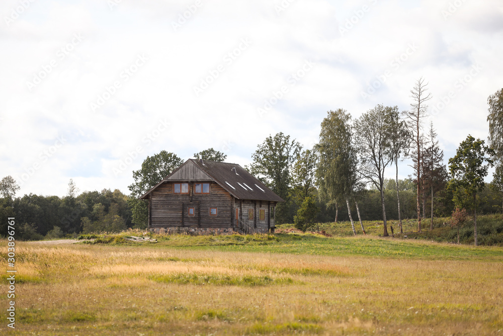 Beautiful countryside view with old wood house looking like for hunters.