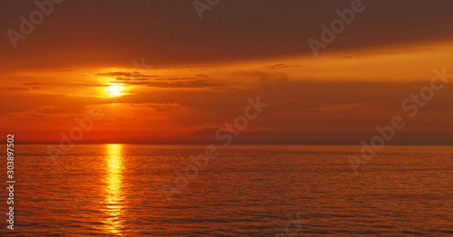 Sunset over the sea in the distance © Алексей Андреев