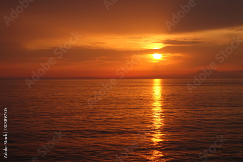 Sunset over the sea in the distance © Алексей Андреев