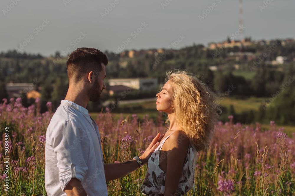 Young man and woman together in the field Young man and woman together in the field