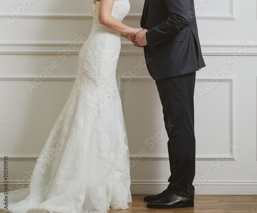 Elegant bride and groom posing together