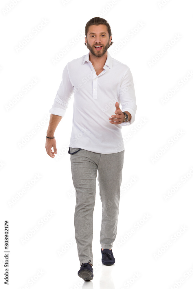 Elegant Man Is Walking Towards Camera, Looking At Camera And Talking Elegant Man Is Walking Towards Camera, Looking At Camera And Talking