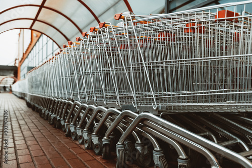 carts for purchase at the store. red food basket trolleys