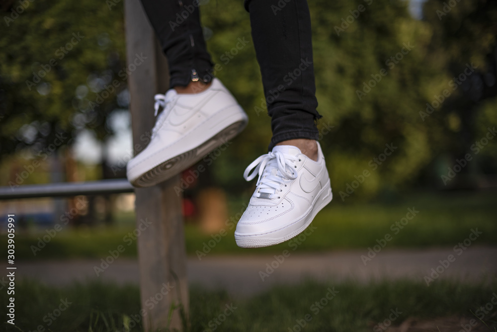 Young man wearing a pair of Nike Air Force Stock Photo | Adobe Stock