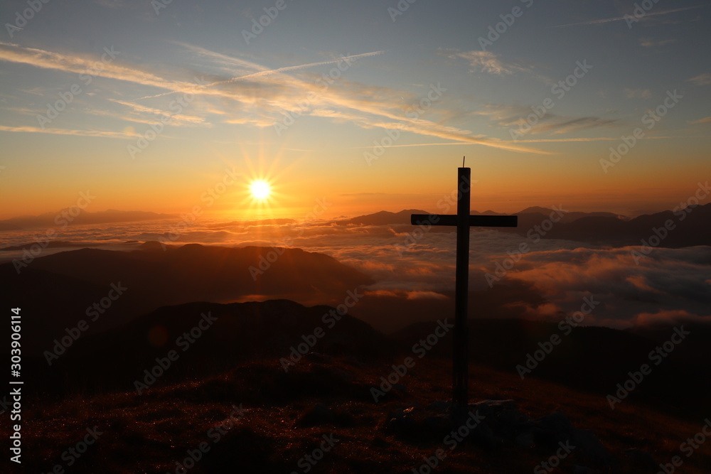 Cross next to morning sun, mountain Ogradi, Bohinj