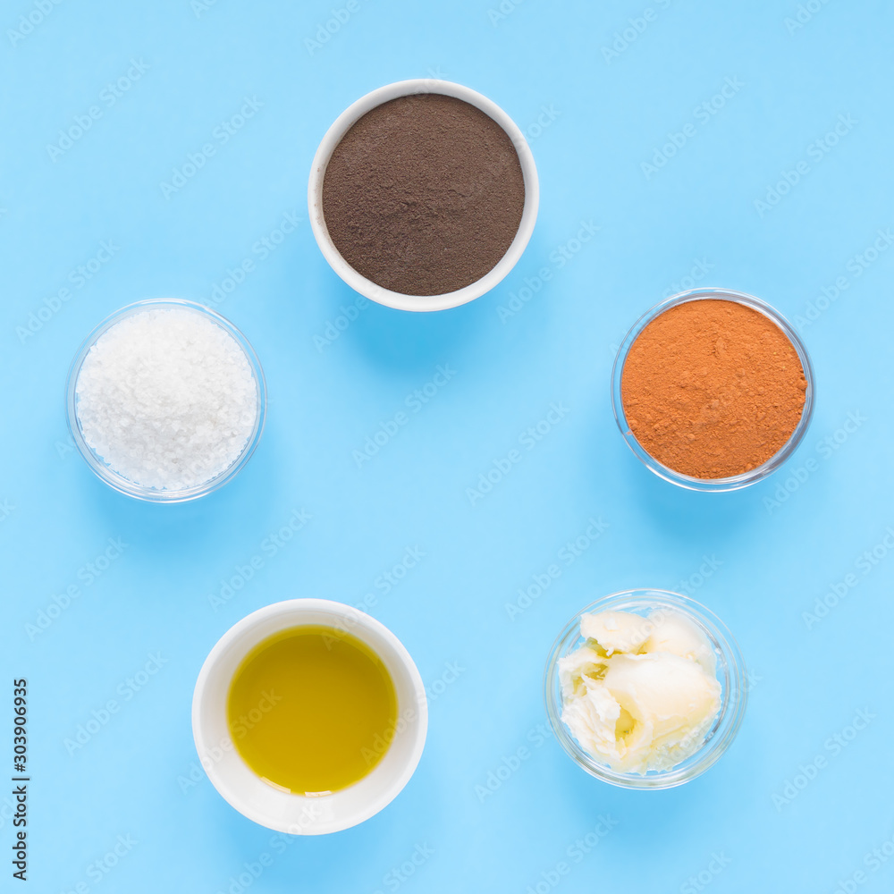 circular composition from spa set natural products for self-care at home on turquoise background. flat lay, top view. square layout circular composition from spa set natural products for self-care at home on turquoise background. flat lay, top view. square layout