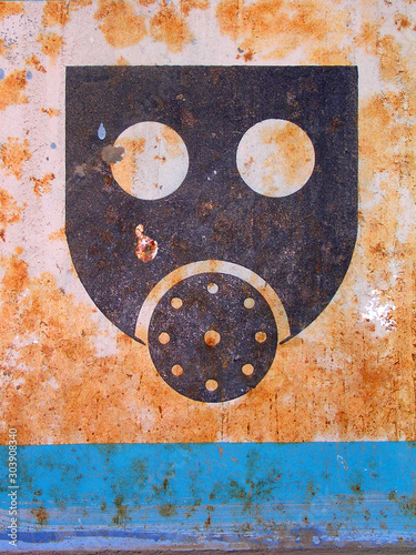 poison mask rusty old sign photo