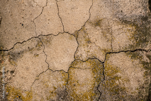 Cracked concrete texture closeup. Abstract cement background