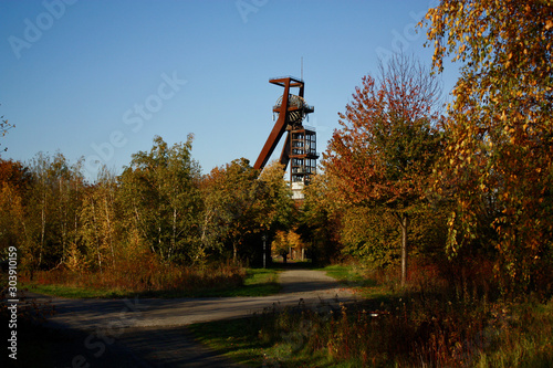 mining tower behind autumn trees