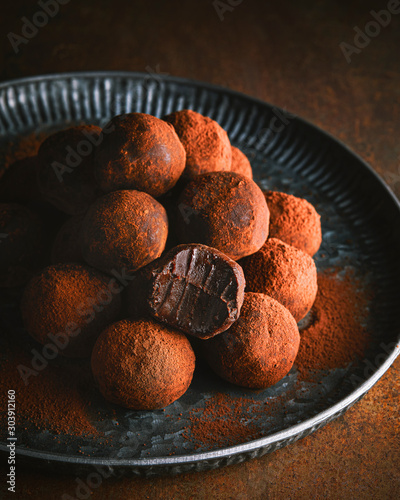 Chocolate truffles in vintage metal plate photo