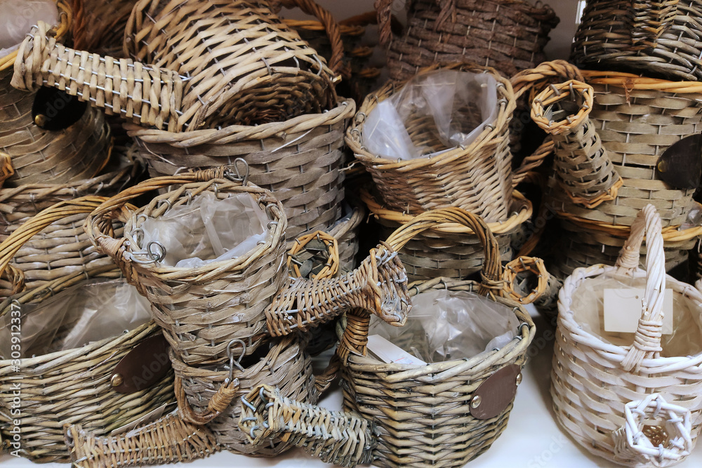 Straw wicker baskets in a shop window Straw wicker baskets in a shop window