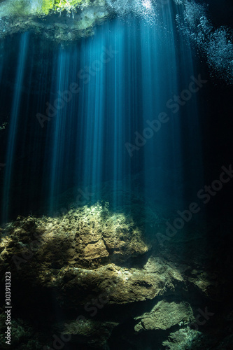 beams of light in a cenote at Yucatan photo