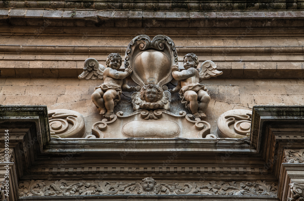 Sculptures of angels as an element of the exterior decoration of a building in the small italian town in Sicily, south Italy