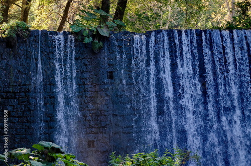 Waterfall in river Bistritsa in autumn by village Pancharevo in Vitosha mountain, Bulgaria photo