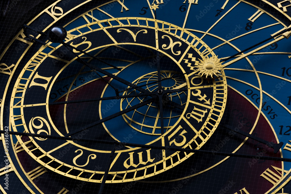 The dominant of Prague astronomical clock on old town times square. Gold wheels shows period, moon phase and next signs. The dominant of Prague astronomical clock on old town times square. Gold wheels shows period, moon phase and next signs.