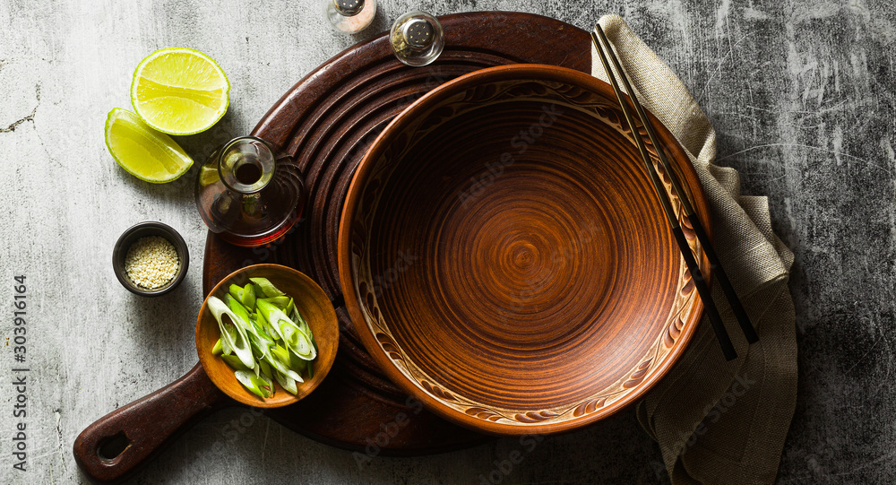 banner of empty clay dishes. serving set on the table banner of empty clay dishes. serving set on the table