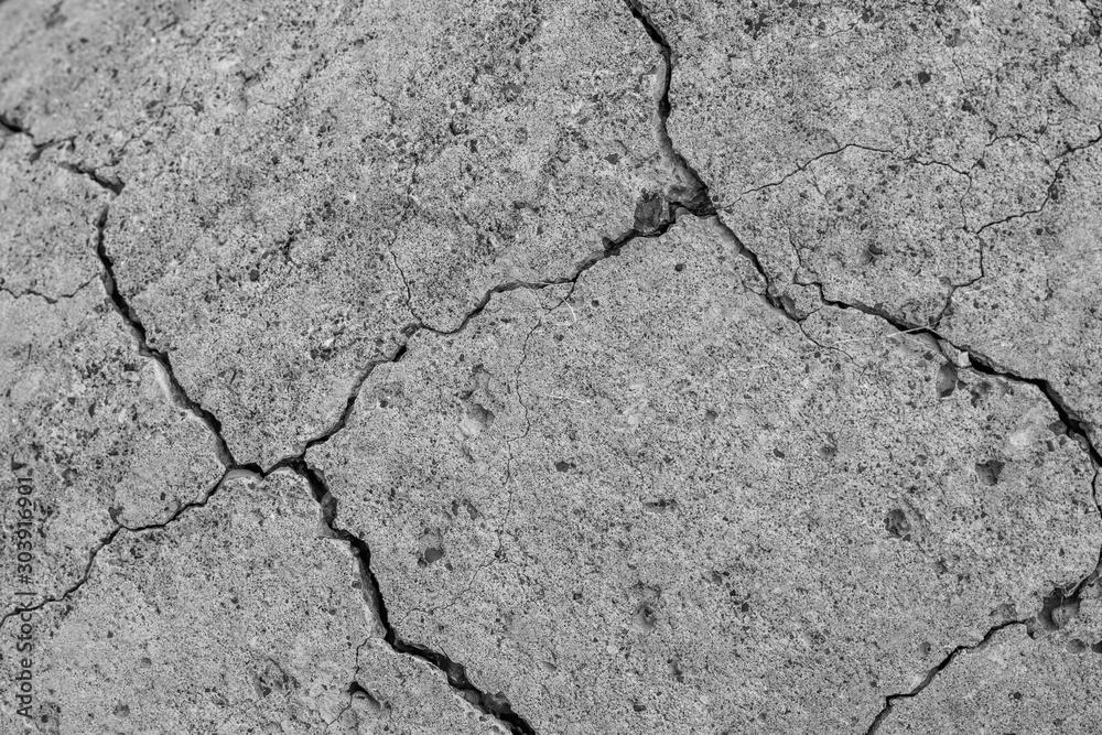 Fototapeta premium Abstract cement background. Cracked concrete texture closeup.