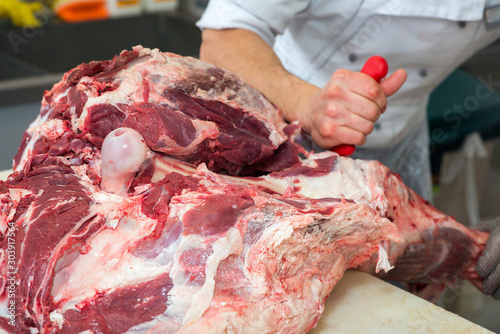 cutting meat in the meat shop