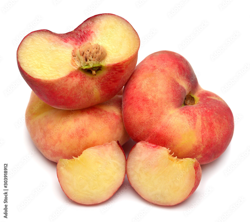 Peach saturn fruit whole and half isolated on white background. Flat lay, top view Peach saturn fruit whole and half isolated on white background. Flat lay, top view
