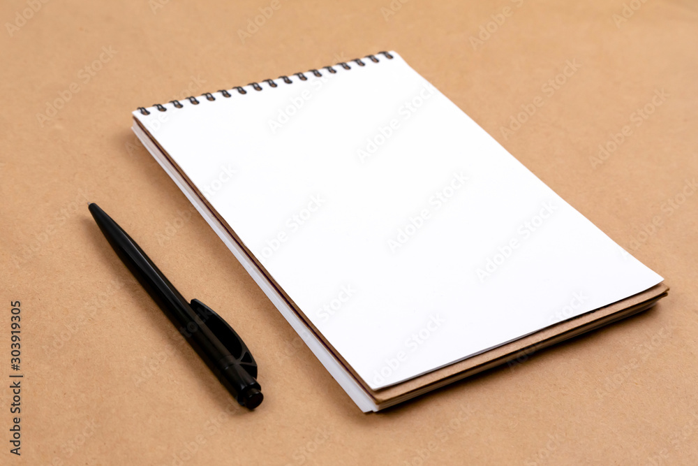 Stationary concept, Flat Lay top view Photo of pencil and notepad on a beige abstract background with copy space, minimal style. Stationary concept, Flat Lay top view Photo of pencil and notepad on a beige abstract background with copy space, minimal style.