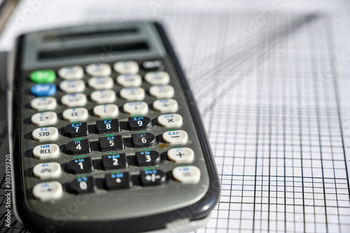 Scientific calculator on top of psychrometric chart photo