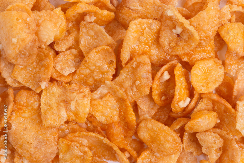 Corn-flakes background and texture, cornflake cereal box for morning breakfast. Corn-flakes background and texture, cornflake cereal box for morning breakfast.