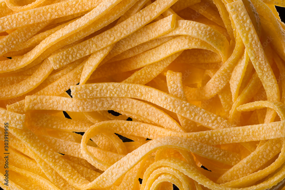 Macro photo nest of fettucine pasta isolated on black with clipping path Macro photo nest of fettucine pasta isolated on black with clipping path