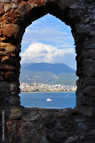 View of the Mediterranean Sea from the window of an abandoned ancient castle, Alanya, Turkey.