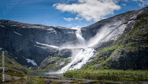 Sotefossen waterfall raging down in Husedalen mountain valley Norway panorama