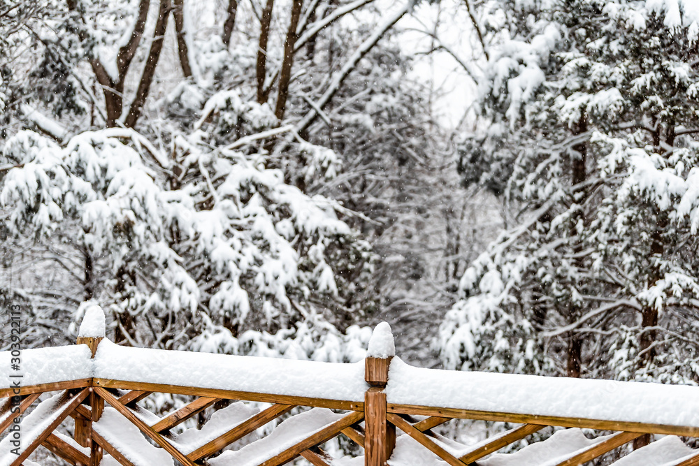 Φωτογραφία Wooden fence covered in white snow after heavy snowing snowstorm storm weather i