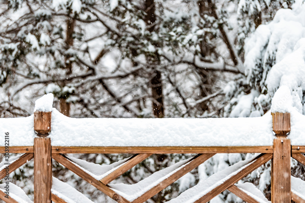 Φωτογραφία Wooden fence closeup covered in white snow after heavy snowing snowstorm storm i
