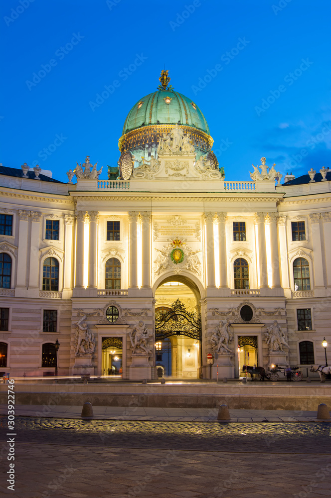 Hofburg palace on St. Michael square (Michaelerplatz) at night, Vienna, Austria 