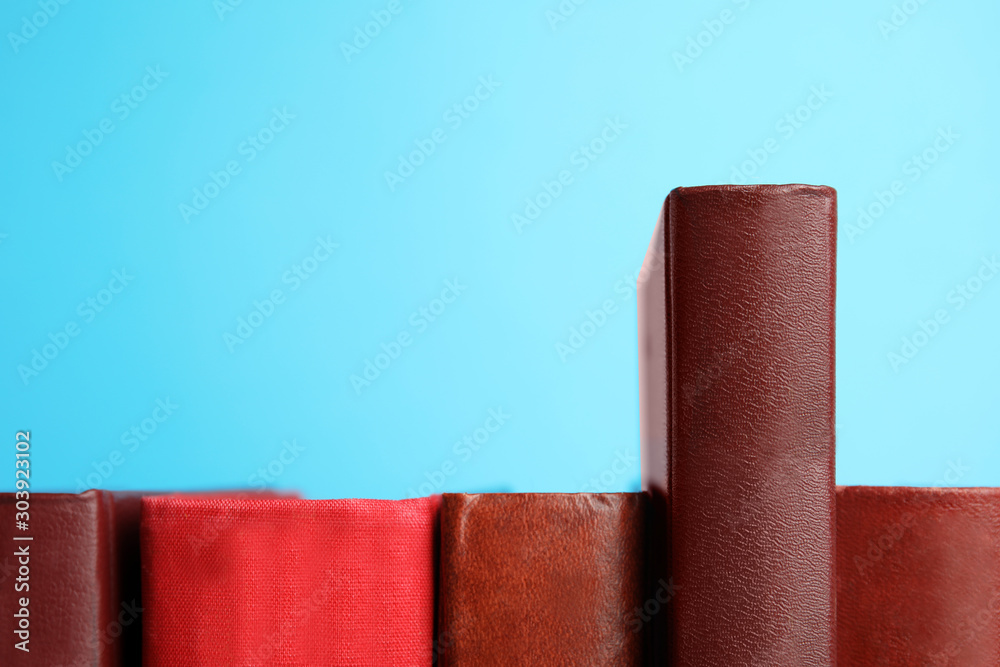 Obraz premium Collection of old books on light blue background
