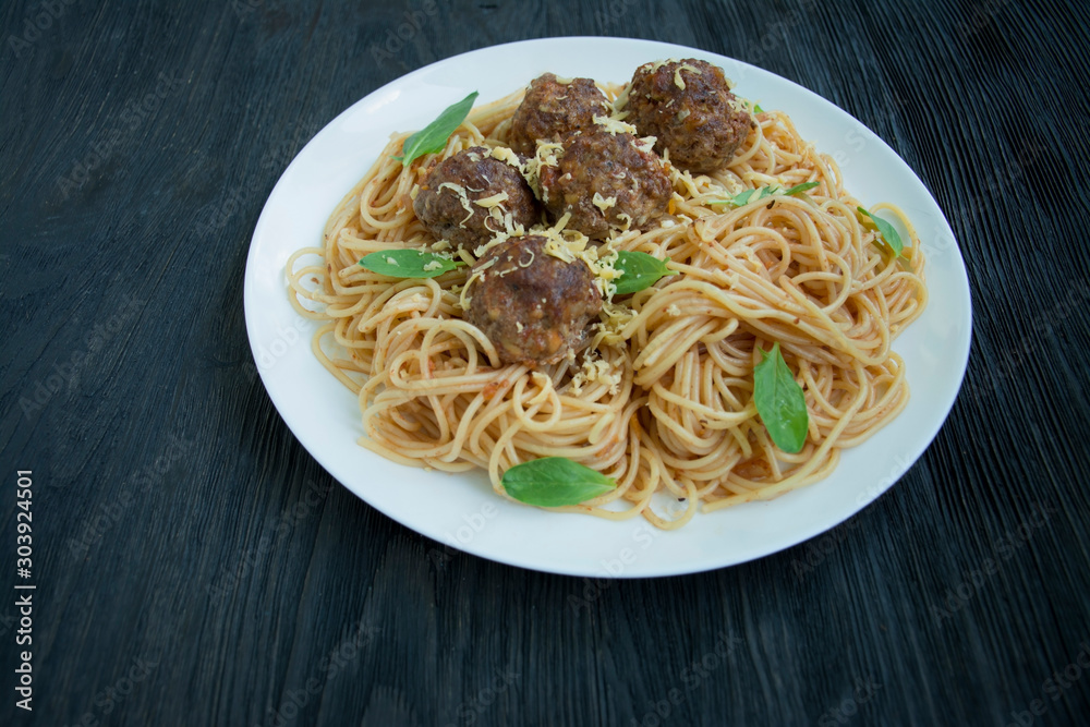 Spaghetti with meatballs and herbs. Carbonara paste. Italian food. Flat lay. Place for text.