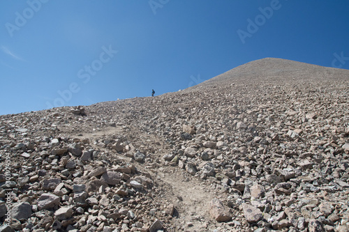 Man hiking in Potanin Glacier in Altai mountains, Mongolia photo