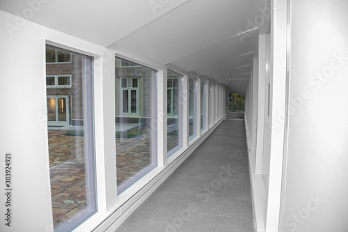 empty long corridor in the modern office building.