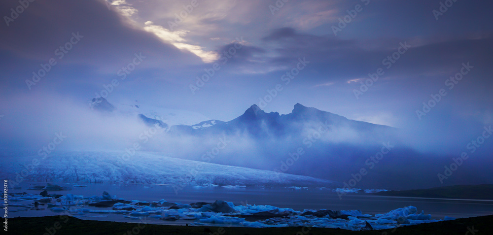 Glacier on Iceland in while sunset