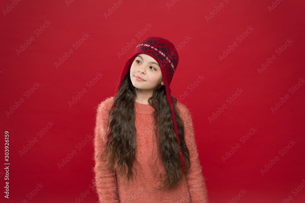Dreamy mood. Little kid wear knitted hat. Stay warm. Little girl winter fashion accessory. Small adorable child long hair wear hat burgundy background. Cute model enjoy winter style. Winter outfit Dreamy mood. Little kid wear knitted hat. Stay warm. Little girl winter fashion accessory. Small adorable child long hair wear hat burgundy background. Cute model enjoy winter style. Winter outfit