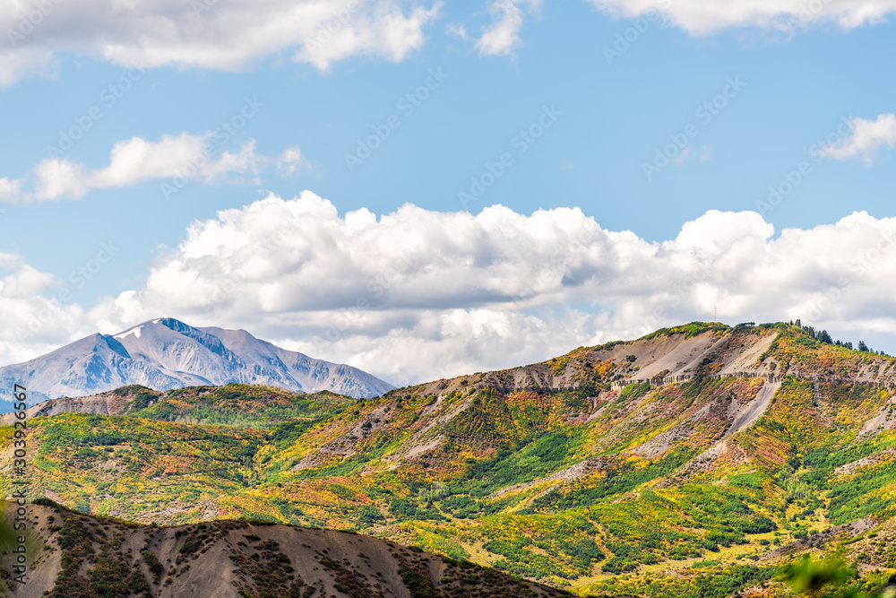 Aspen, Colorado with rocky mountains peak and vibrant color of autumn foliage on plants in roaring fork valley in 2019