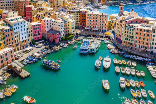 Aerial view of Camogli. Colorful buildings near the ligurian sea beach. View from above on boats and yachts moored in marina with green blue water. photo